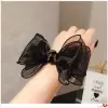 A new Korean version of fashionable lace bow hair tie, diamond knot, pearl hair band, bun hair and leather band hair accessory for women Specification image